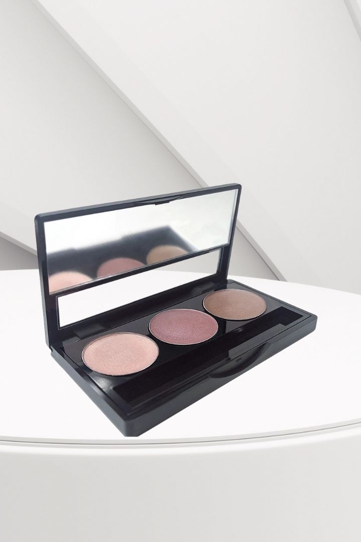 Makeup palette with four shades on a white surface