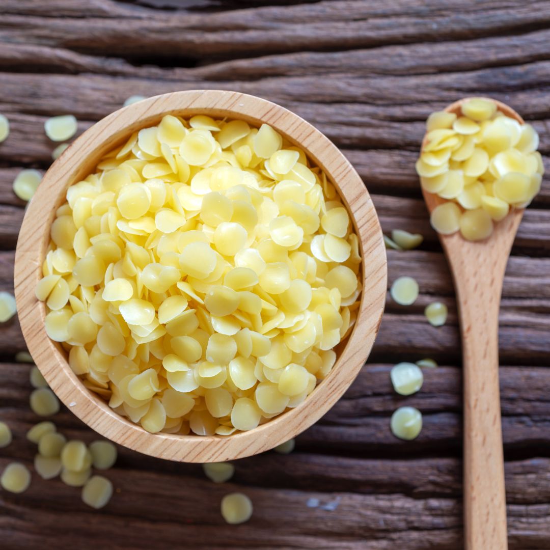 Natural Beewax in a bowl on  brown table