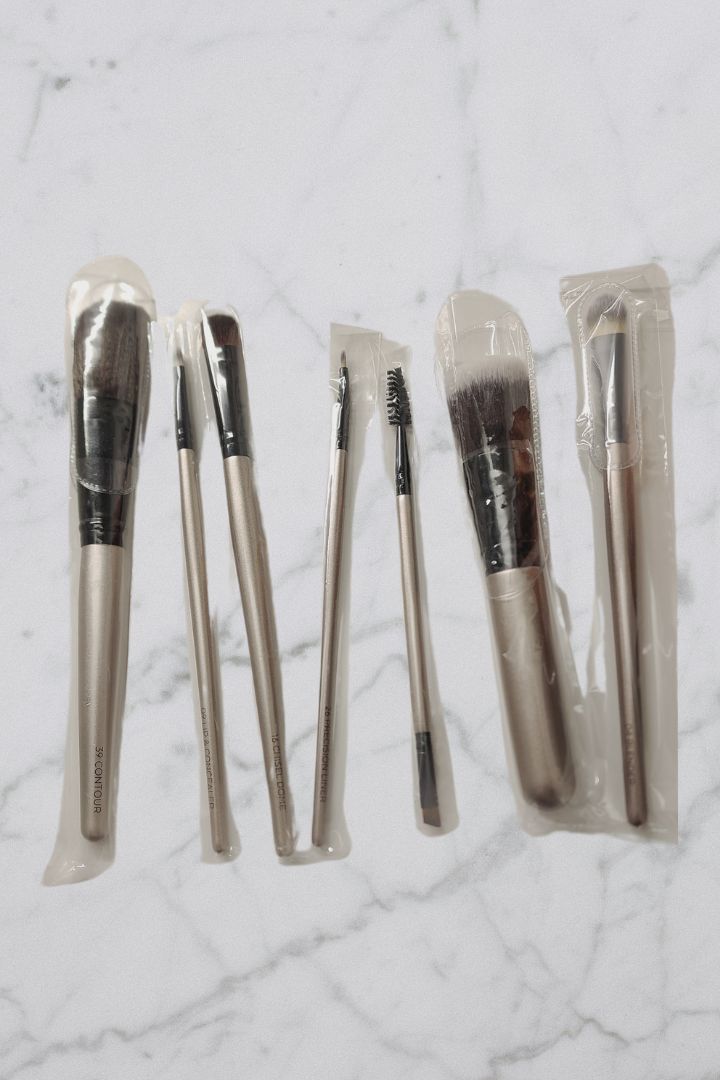 Set of 7 brushes on marble table