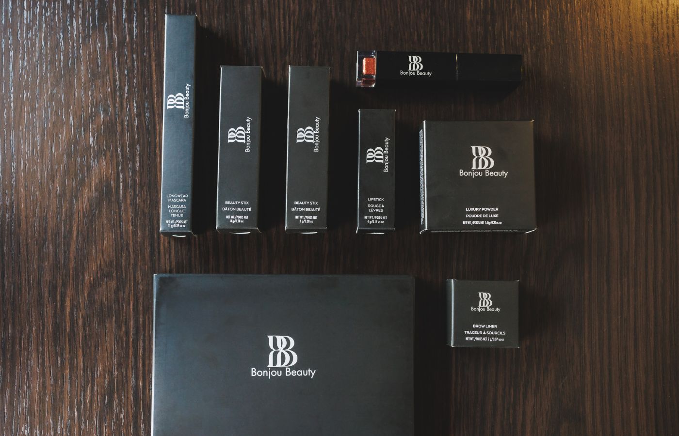 Makeup products in packaging flat on a table