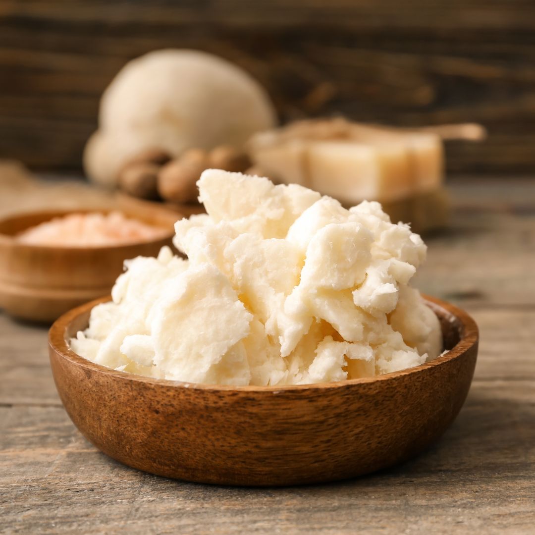 Shea butter in a bowl on a wooden table