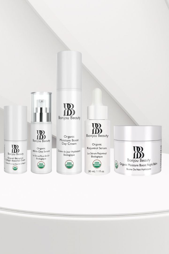 Collagen Eye Boost Crean, All in One Serum, Moisture Boost Day Cream, Rejuvinol Serum, Moisture Boost Night Balm products on a white table and backgrop