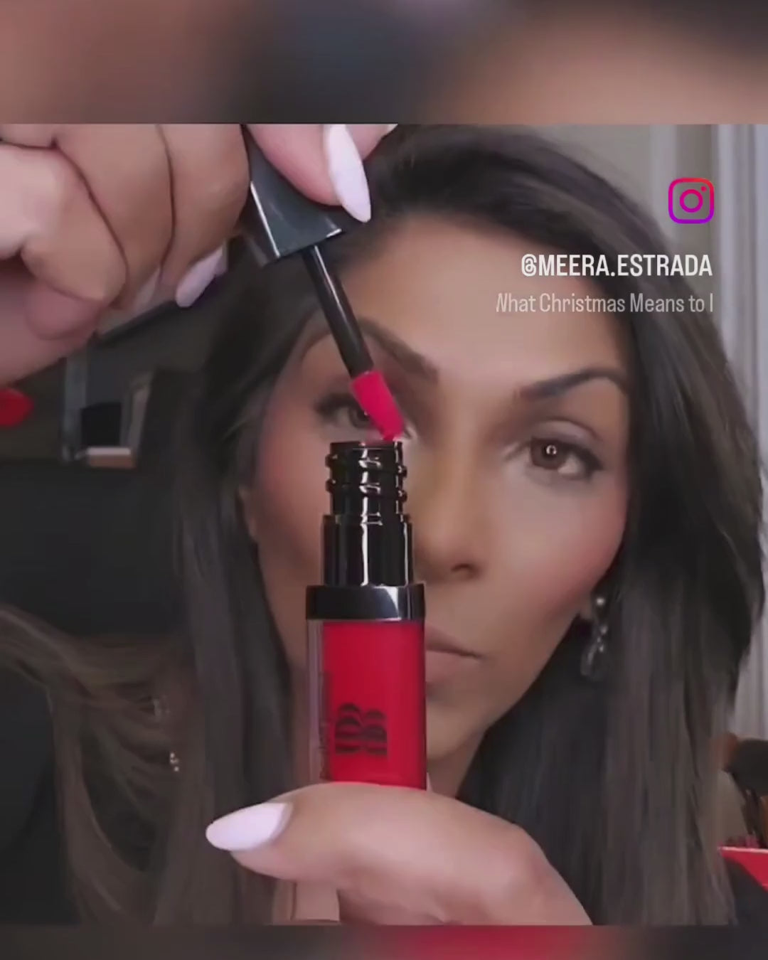Beauty Expert Meera Estrada applying Bonjou Beauty Fire Engine Red lip gloss