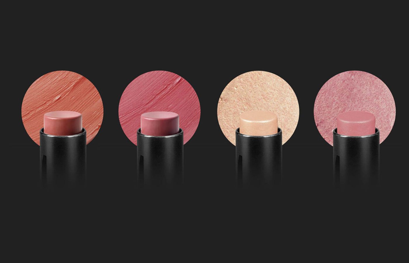 Four different shades of Bonjou Beauty Stix on a black background