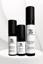 3 Bonjou Beauty skincare products with white and black packaging on a white table and background