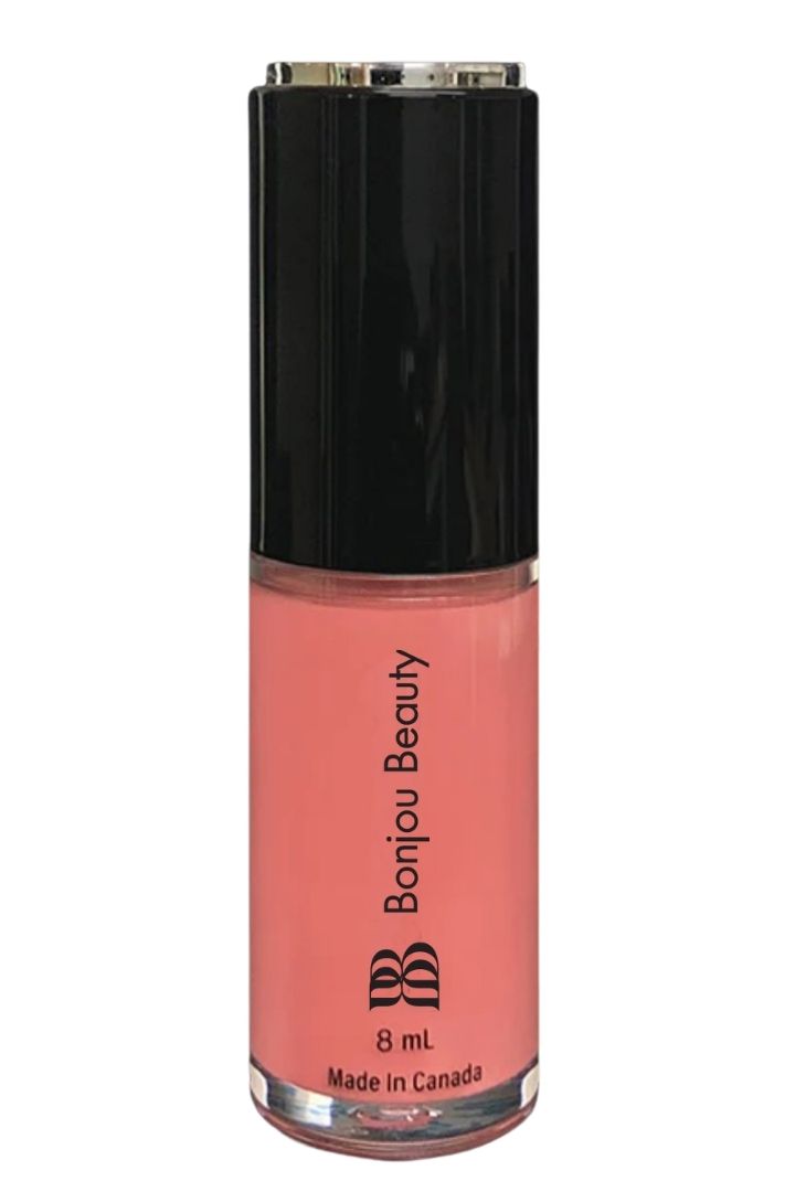 Baby shade vegan lip gloss on a white background