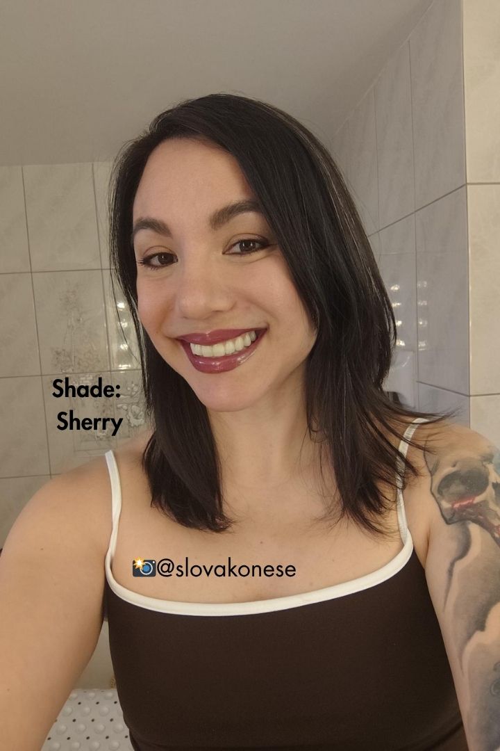 customer selfie wearing the shade Sherry vegan lip gloss