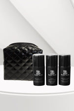 Black quilted makeup bag with three black Bonjou Beauty branded bottles on a white surface