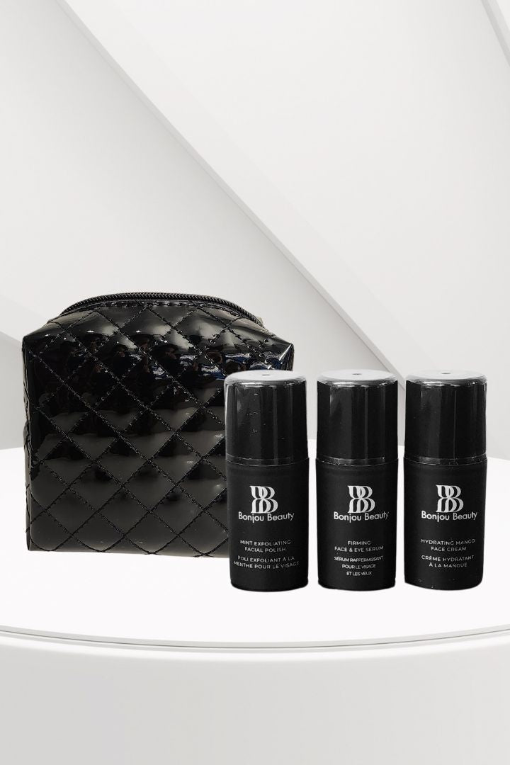 Black quilted makeup bag with three black Bonjou Beauty branded bottles on a white surface