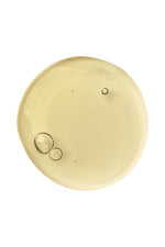 drop of Balancing Act cleanser to show the texture and yellowish shade on a white background