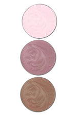 Three round eyeshadow shades in pink, rose, and beige on a white background