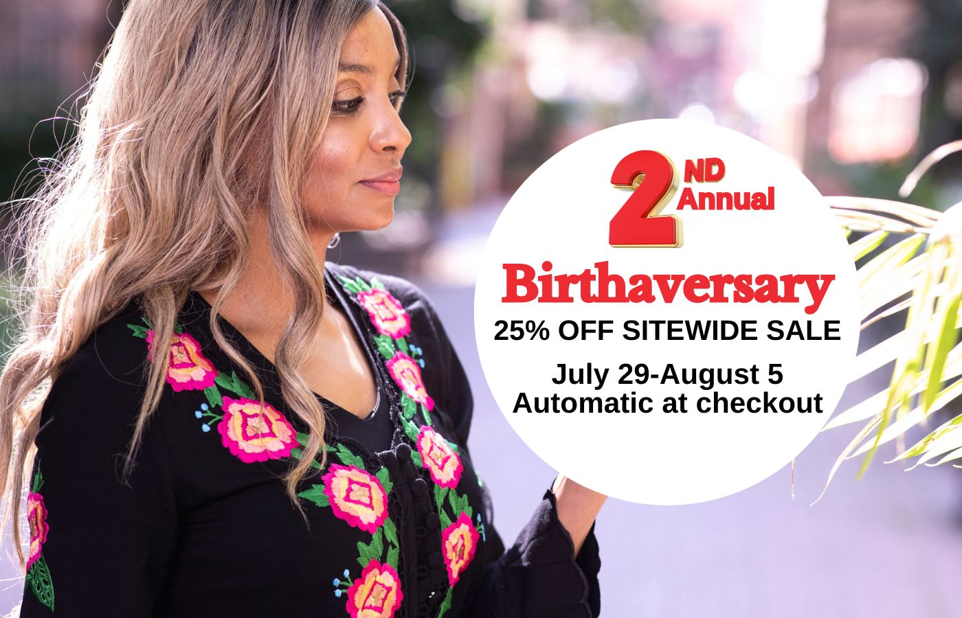 Woman wearing a black top with floral embroidery, with a Birthaversary sale promotion overlay.
