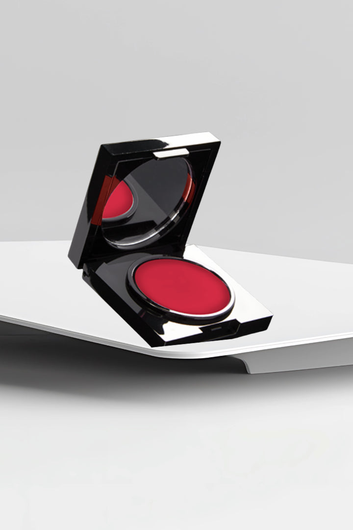 Double Duty Cream open compact in red