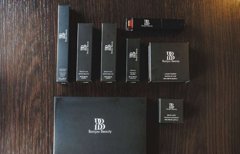 Makeup products in packaging flat on a table