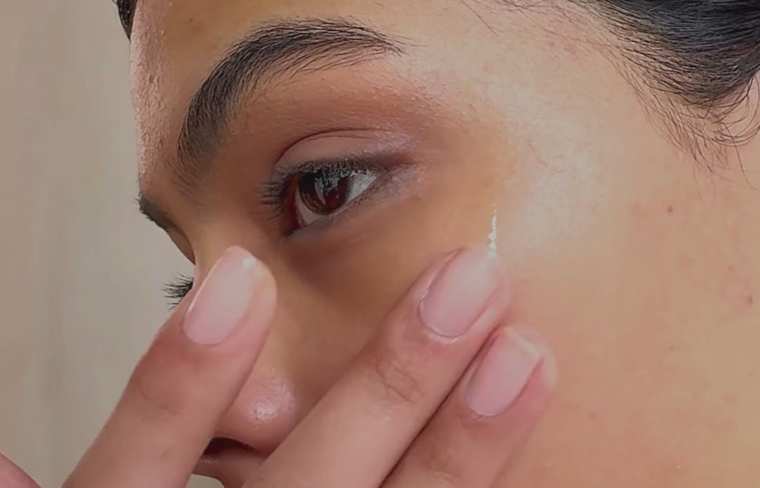 Close up of woman putting serum on cheek